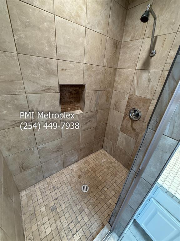 18240 Midway Road, Unit 606 Dallas, TX 75287 - Photo 19 of 25 a bathroom with a shower
