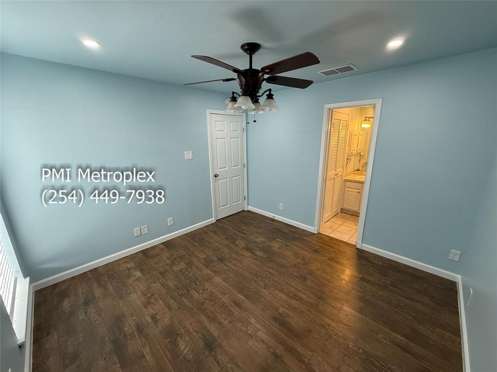 18240 Midway Road, Unit 606 Dallas, TX 75287 - Photo 22 of 25 an empty room with windows and ceiling fan
