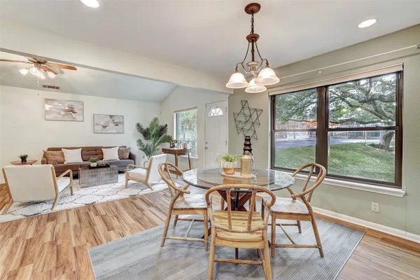 a view of a dining room with furniture window and outside view