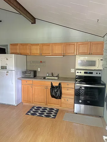 a kitchen with stainless steel appliances a stove and a refrigerator