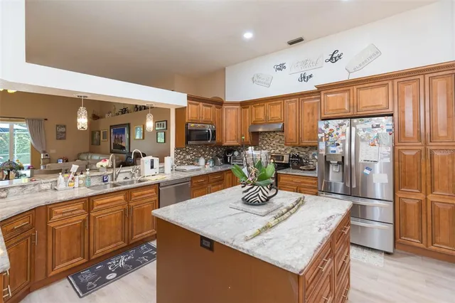 a dining area with furniture and wooden floor
