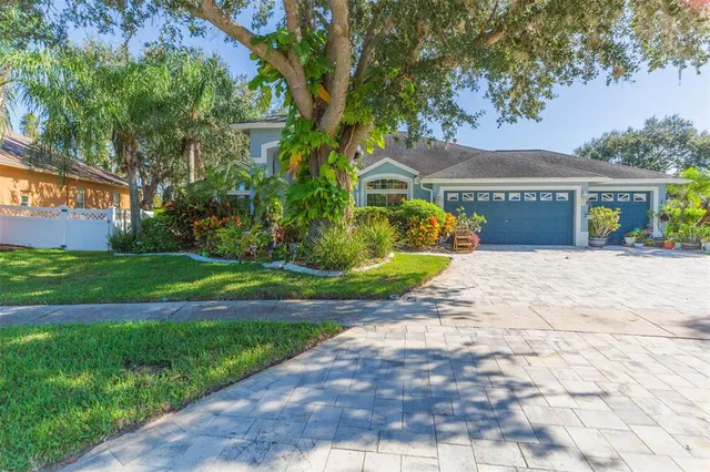 a front view of house with yard and green space