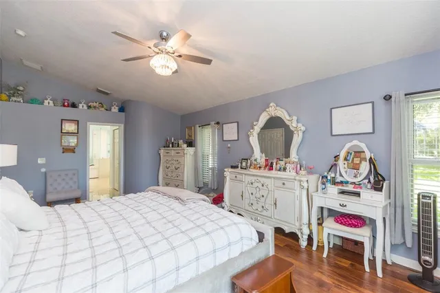 a bathroom with a sink a mirror and a shower
