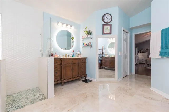 a bathroom with a double vanity sink and a mirror