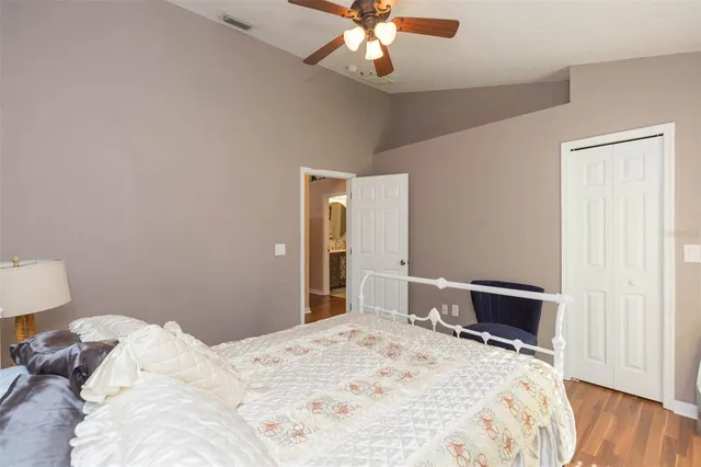 a bed sitting in a bedroom next to a window