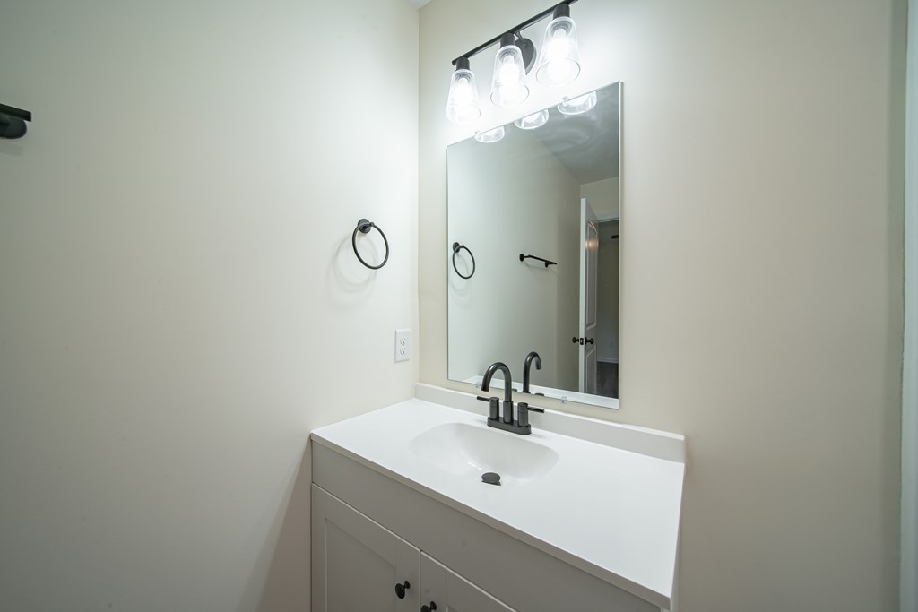 4390 Forrest Road Columbus, GA 31907 - Photo 21 of 26 a bathroom with a sink and a mirror