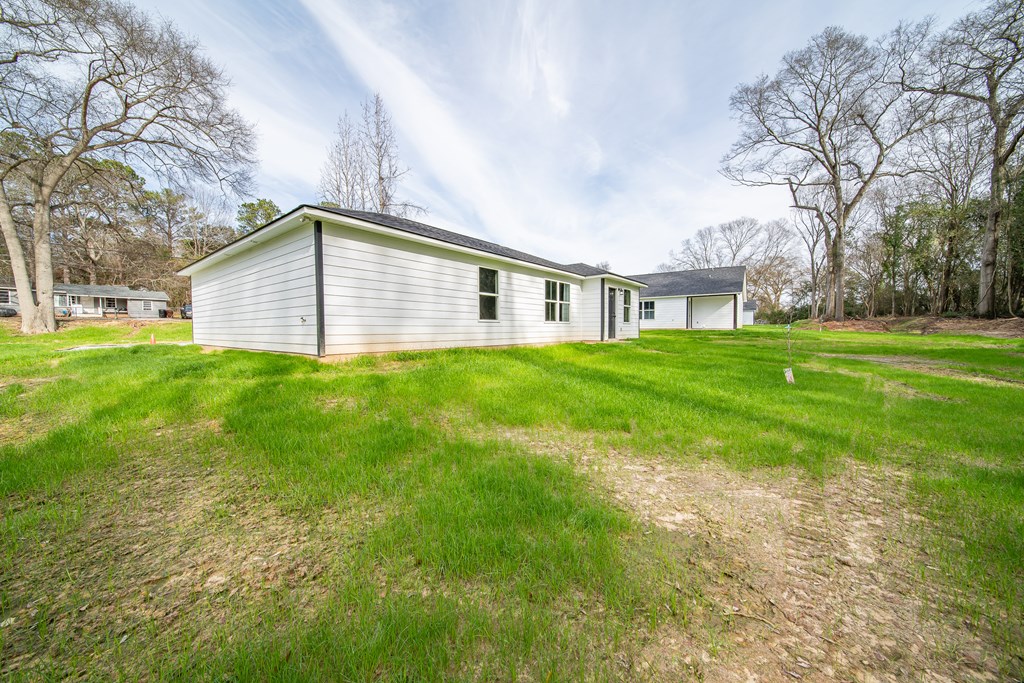 4390 Forrest Road Columbus, GA 31907 - Photo 26 of 26 a front view of house with yard and trees all around