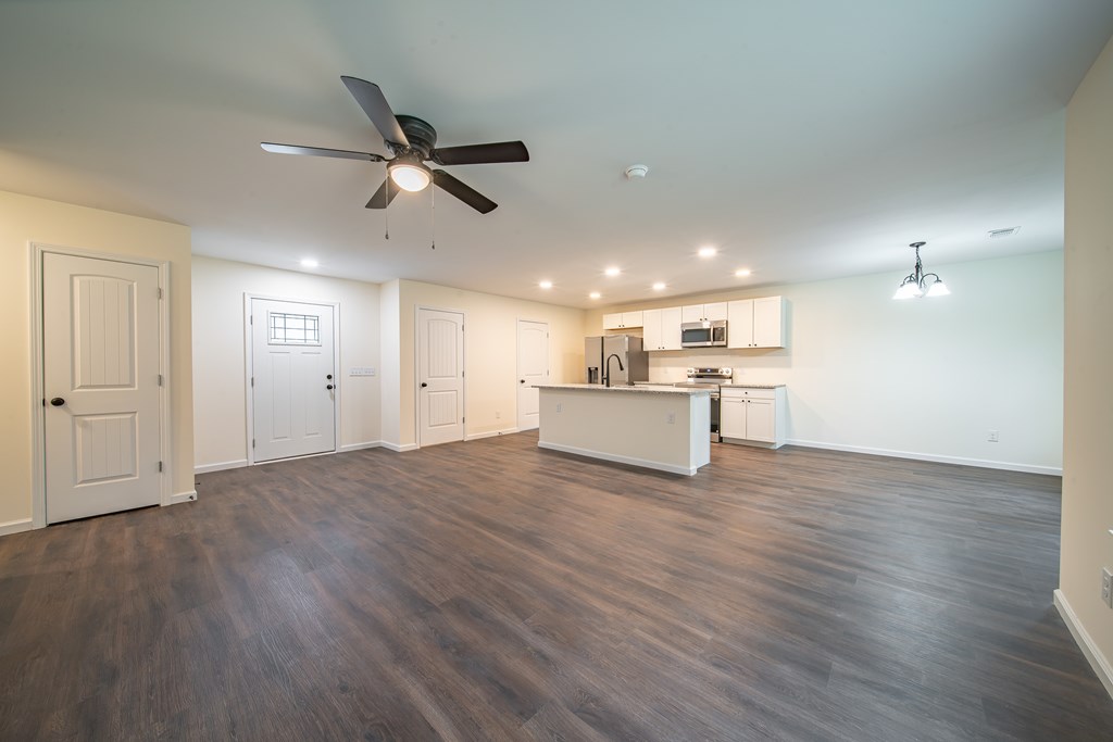 4390 Forrest Road Columbus, GA 31907 - Photo 5 of 26 a view of a livingroom with a ceiling fan wooden floor and a ceiling fan