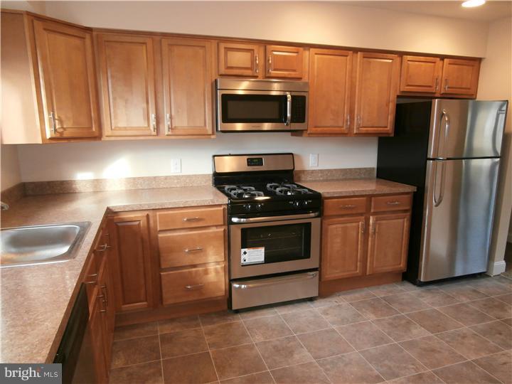 201 Kent Road Williamstown, NJ 08094 - Photo 7 of 11 a kitchen with cabinets and steel stainless steel appliances