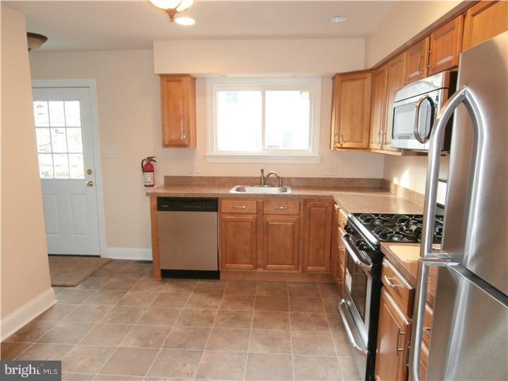 201 Kent Road Williamstown, NJ 08094 - Photo 9 of 11 a kitchen with stainless steel appliances granite countertop a stove a sink and a refrigerator
