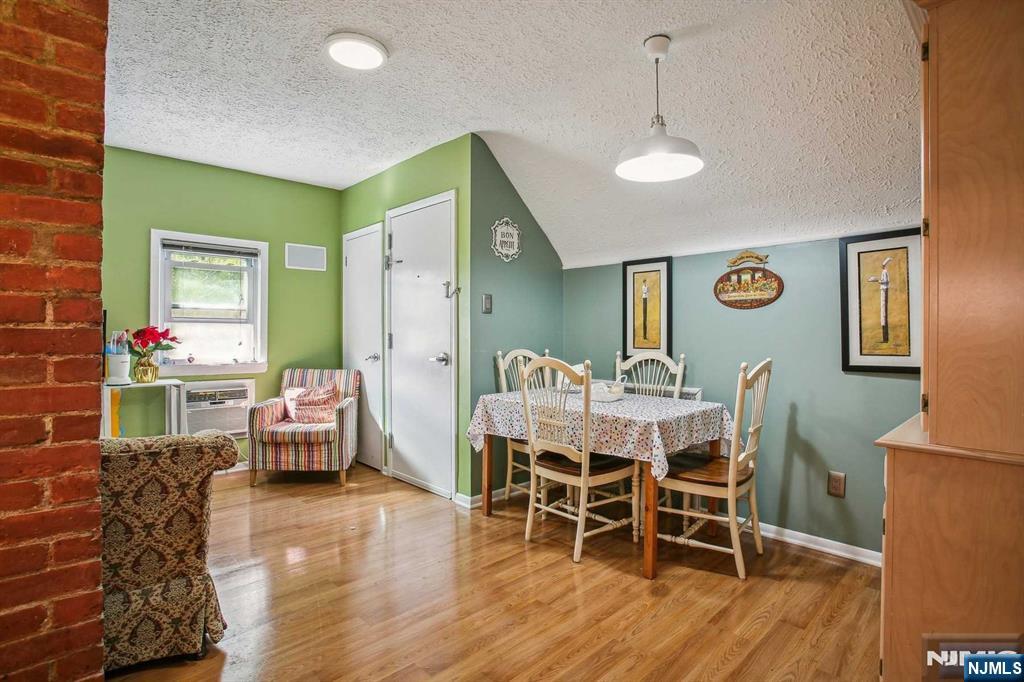 16 Henry Street, Unit 3 Bloomfield, NJ 07003 - Photo 12 of 21 a dining room with furniture and wooden floor