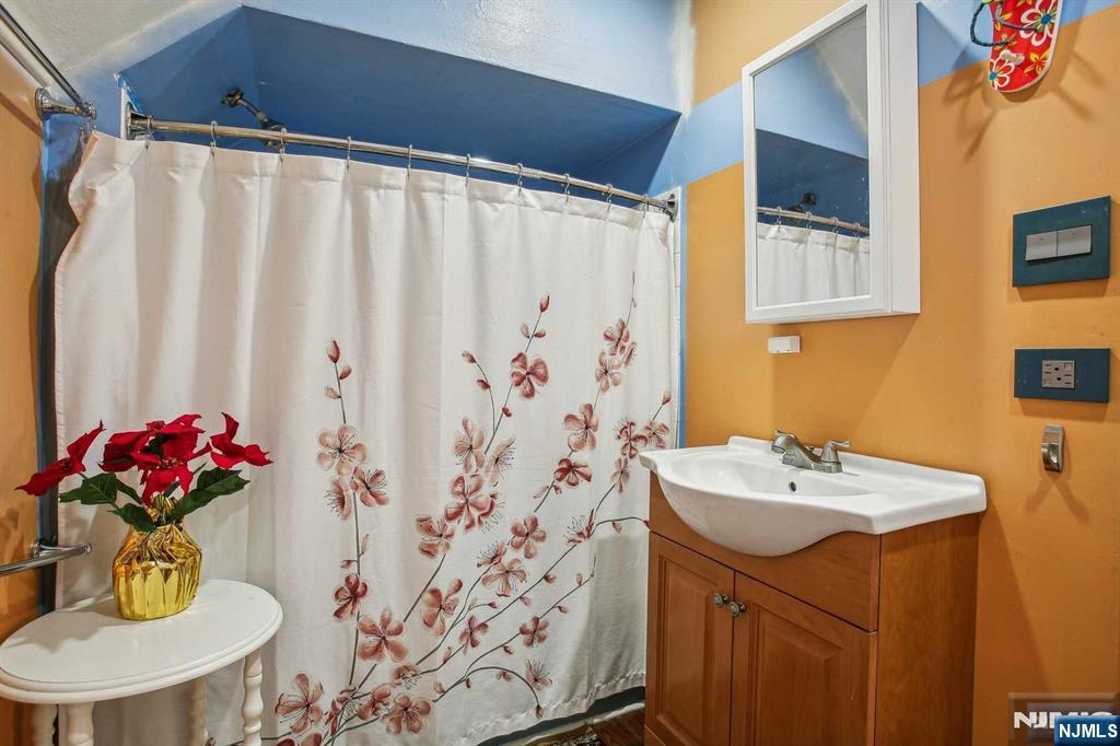 16 Henry Street, Unit 3 Bloomfield, NJ 07003 - Photo 17 of 21 a bathroom with a sink and a mirror