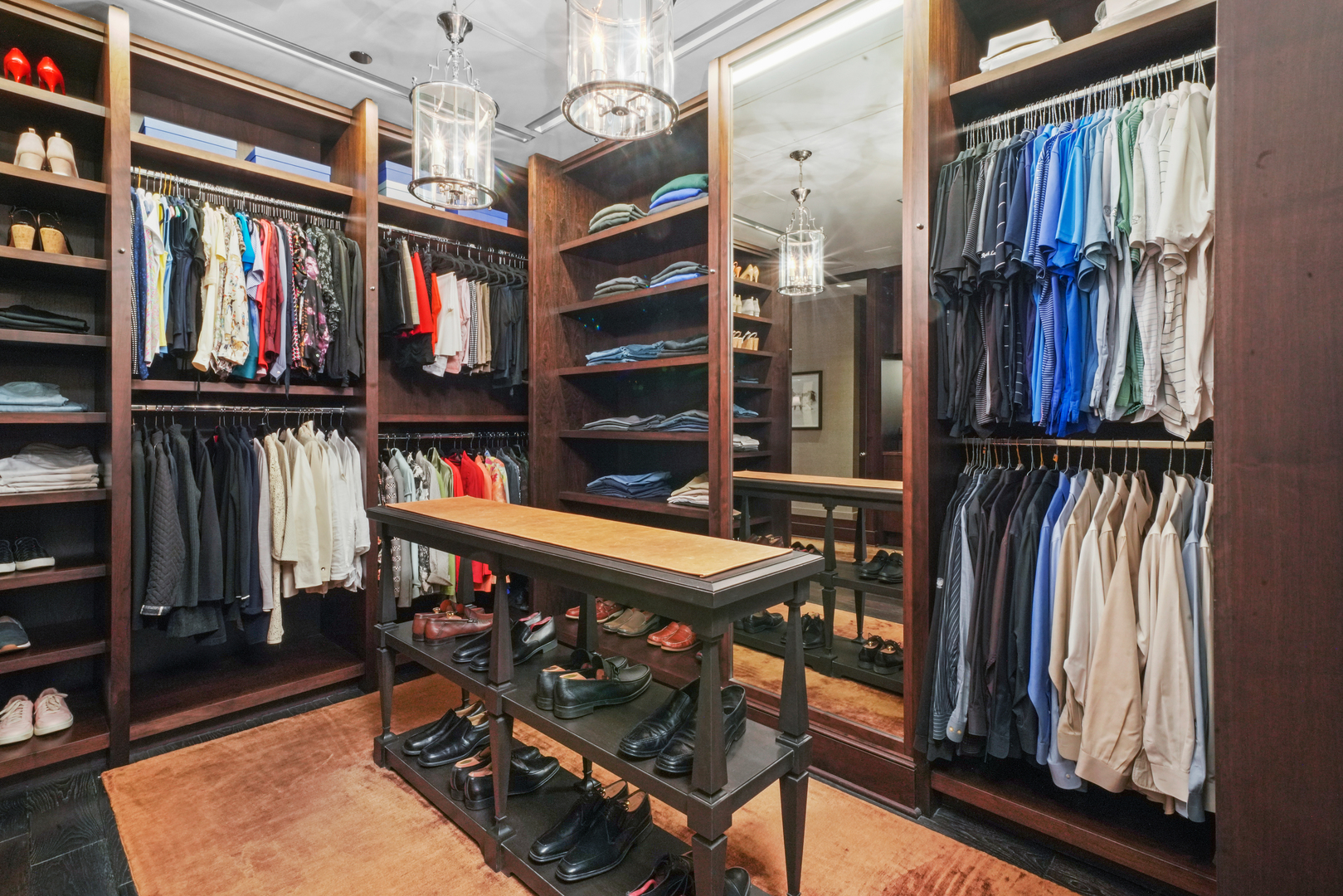 10 East Delaware Place, Unit 34A Chicago, IL 60611 - Photo 32 of 51 a view of walk in closet with clothes and shoes