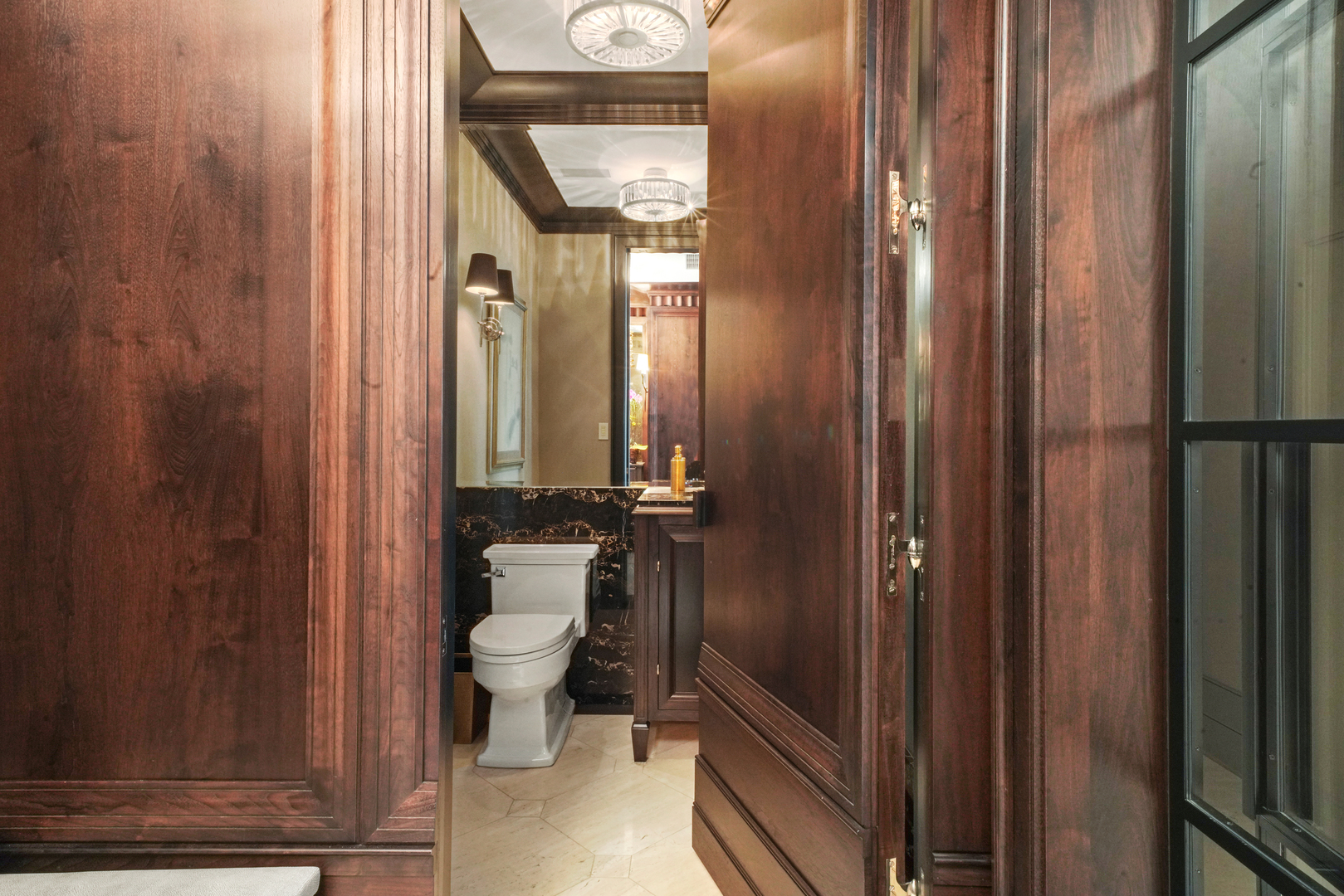 10 East Delaware Place, Unit 34A Chicago, IL 60611 - Photo 35 of 51 a bathroom with a toilet a sink and shower curtain