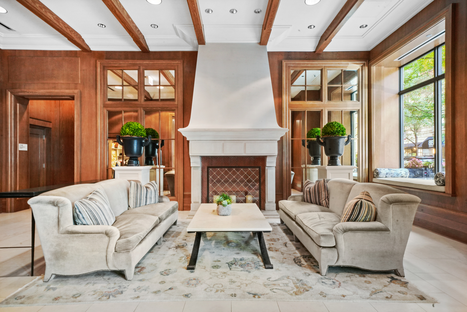 10 East Delaware Place, Unit 34A Chicago, IL 60611 - Photo 45 of 51 a living room with furniture a large window and a fireplace