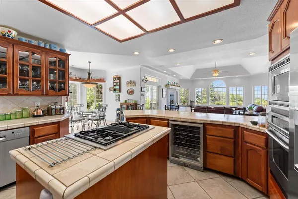 a dining room with furniture and a window