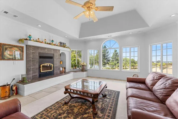 a living room with furniture and a large window
