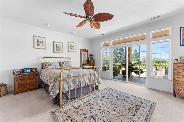 a bathroom with a tub sink double vanity and mirror