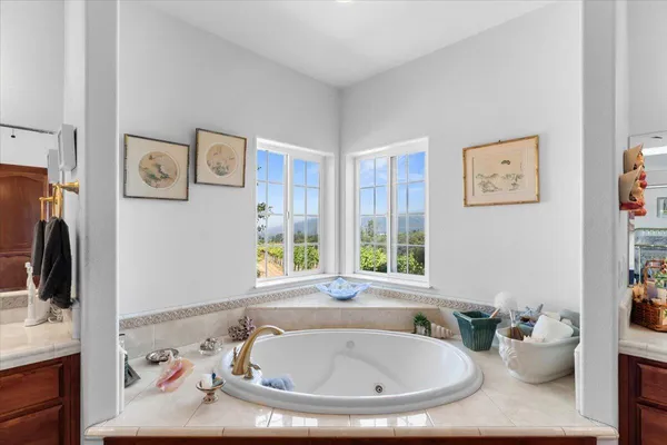 a large bathroom with a glass door shower and sink