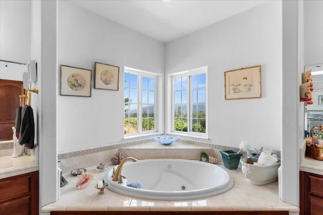 a large bathroom with a glass door shower and sink