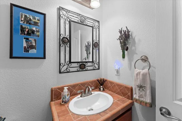a living room with lots of furniture and kitchen view