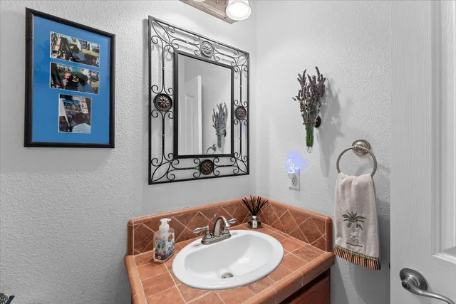 a living room with lots of furniture and kitchen view