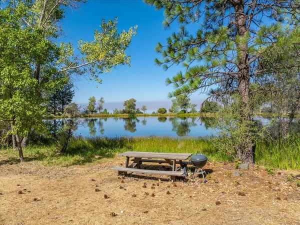 a view of a large body of water with a building in the background