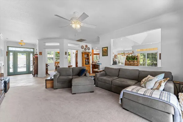 a view of a dining room with furniture window and outside view