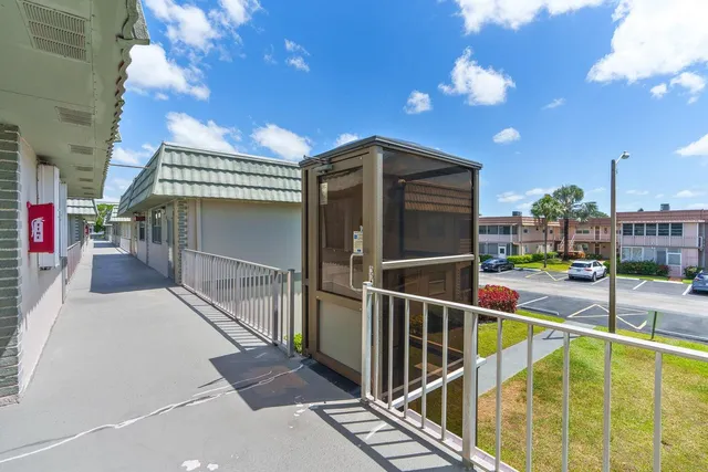 a view of a balcony with staircase