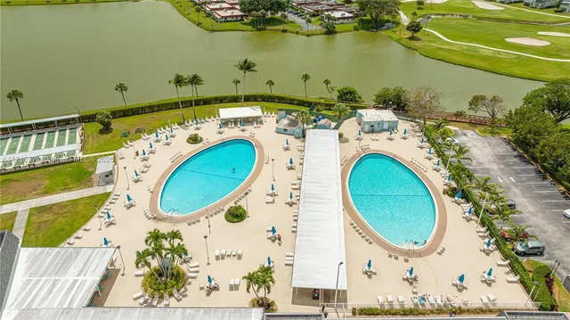 an aerial view of a house with a swimming pool