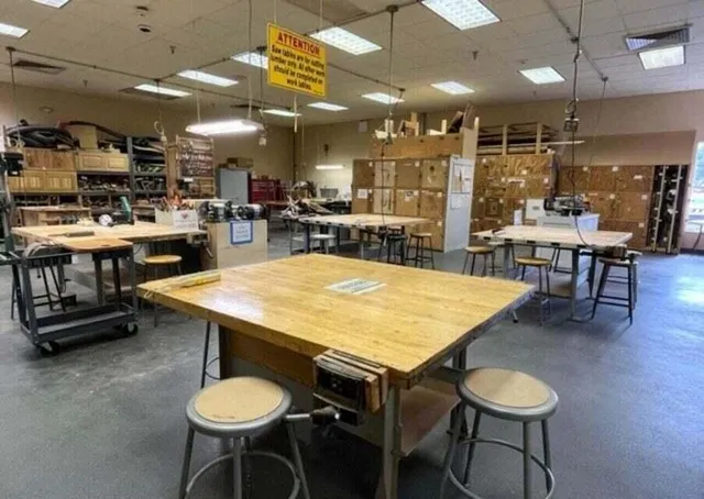 a kitchen with a table and chairs in it