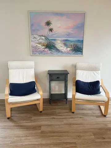 a living room with a bed and window