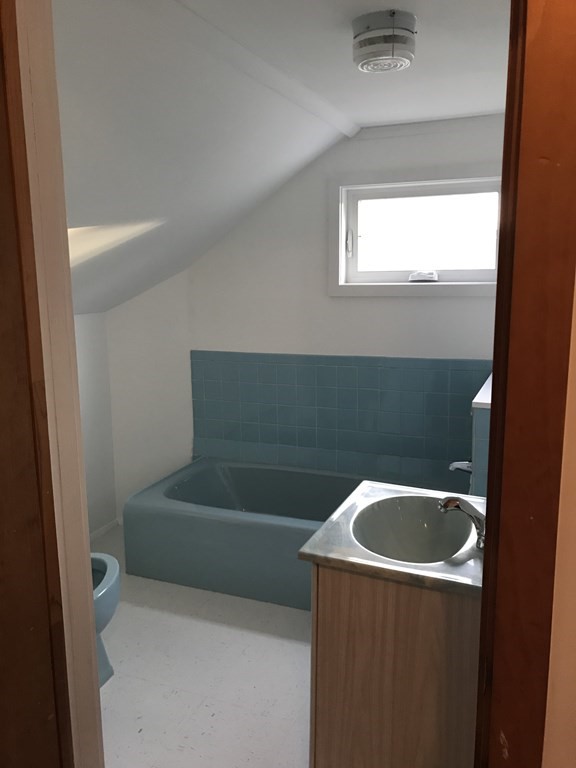 167 Detroit Street Fall River, MA 02721 - Photo 8 of 19 a bathroom with a bathtub