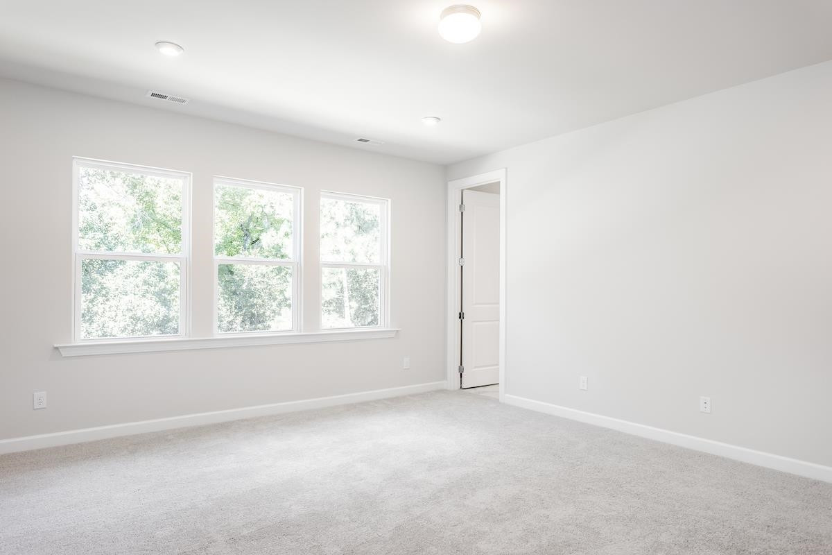 7804 Sofiana Avenue Raleigh, NC 27617 - Photo 14 of 28 an empty room with windows