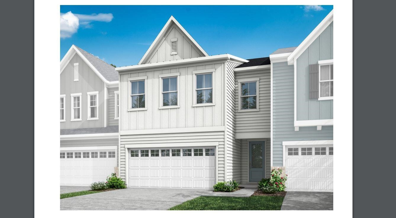 7804 Sofiana Avenue Raleigh, NC 27617 - Photo 2 of 28 a front view of a house with a yard and garage