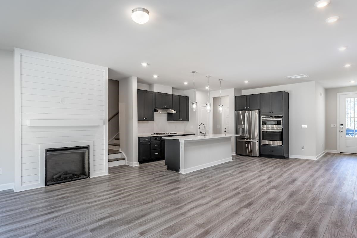 7804 Sofiana Avenue Raleigh, NC 27617 - Photo 9 of 28 a view of kitchen with sink microwave and stove