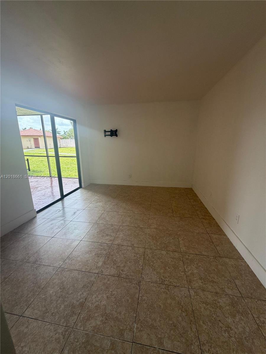 3396 Foxcroft Road, Unit 113 Miramar, FL 33025 - Photo 11 of 17 an empty room with windows
