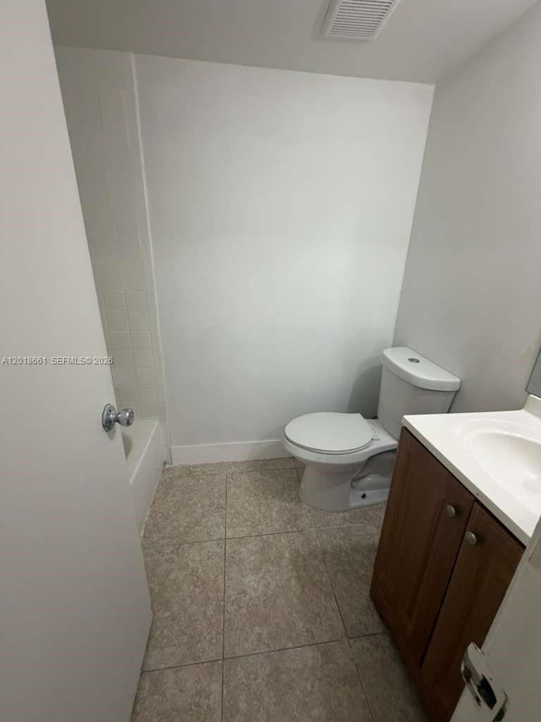 3396 Foxcroft Road, Unit 113 Miramar, FL 33025 - Photo 12 of 17 a bathroom with a toilet and a shower