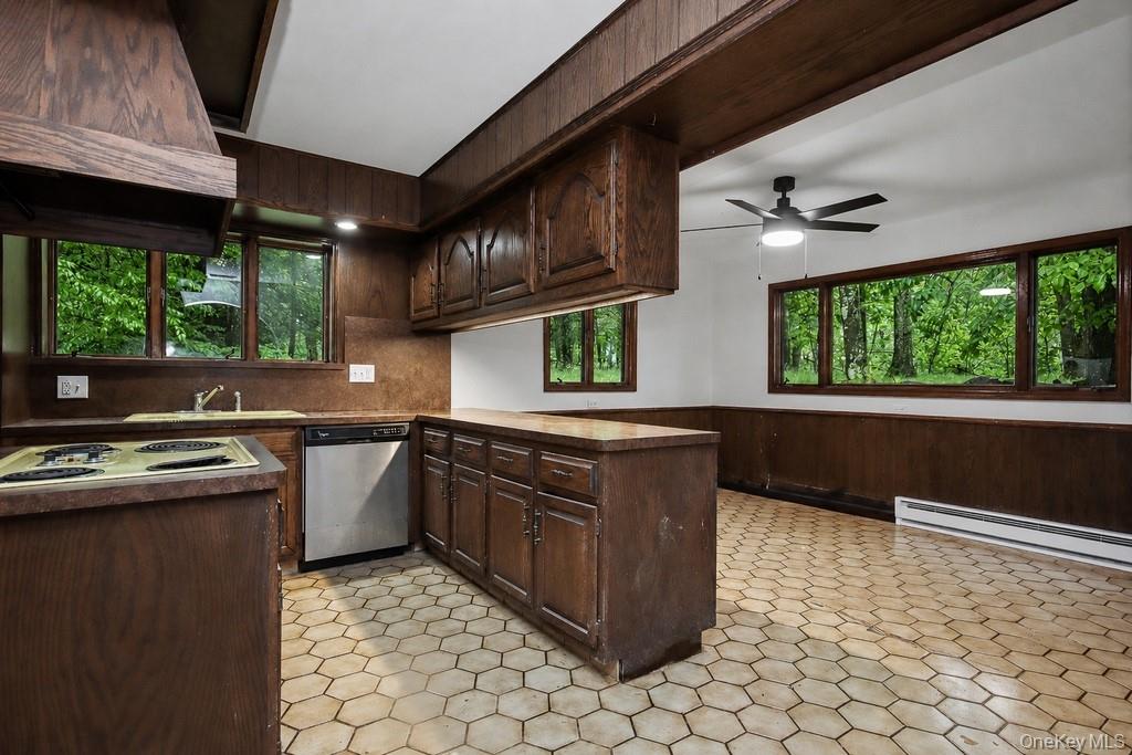 18 Hillside View Road Mahopac, NY 10541 - Photo 26 of 42 a kitchen with stainless steel appliances granite countertop a stove a sink and a microwave