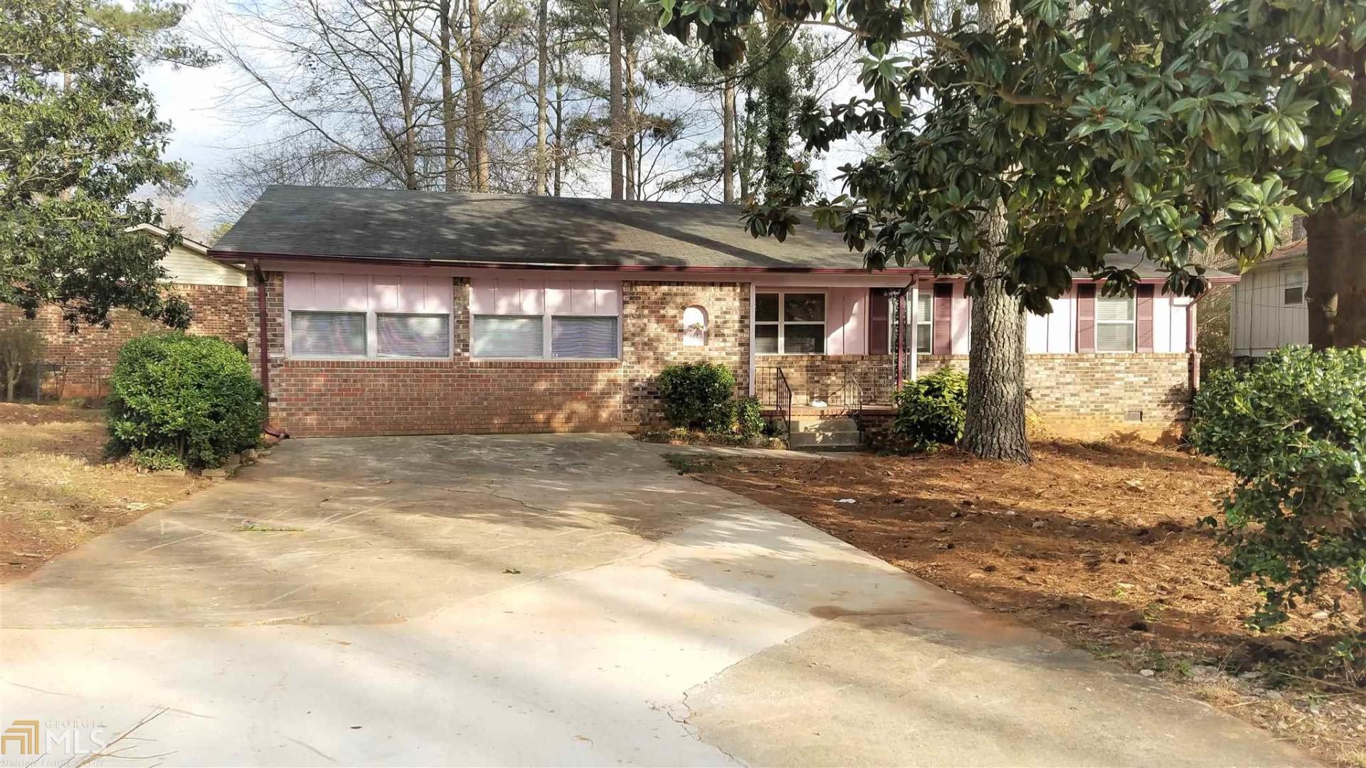 4083 Northstrand Drive Decatur, GA 30035 - Photo 1 of 1 a front view of a house with a yard and garage
