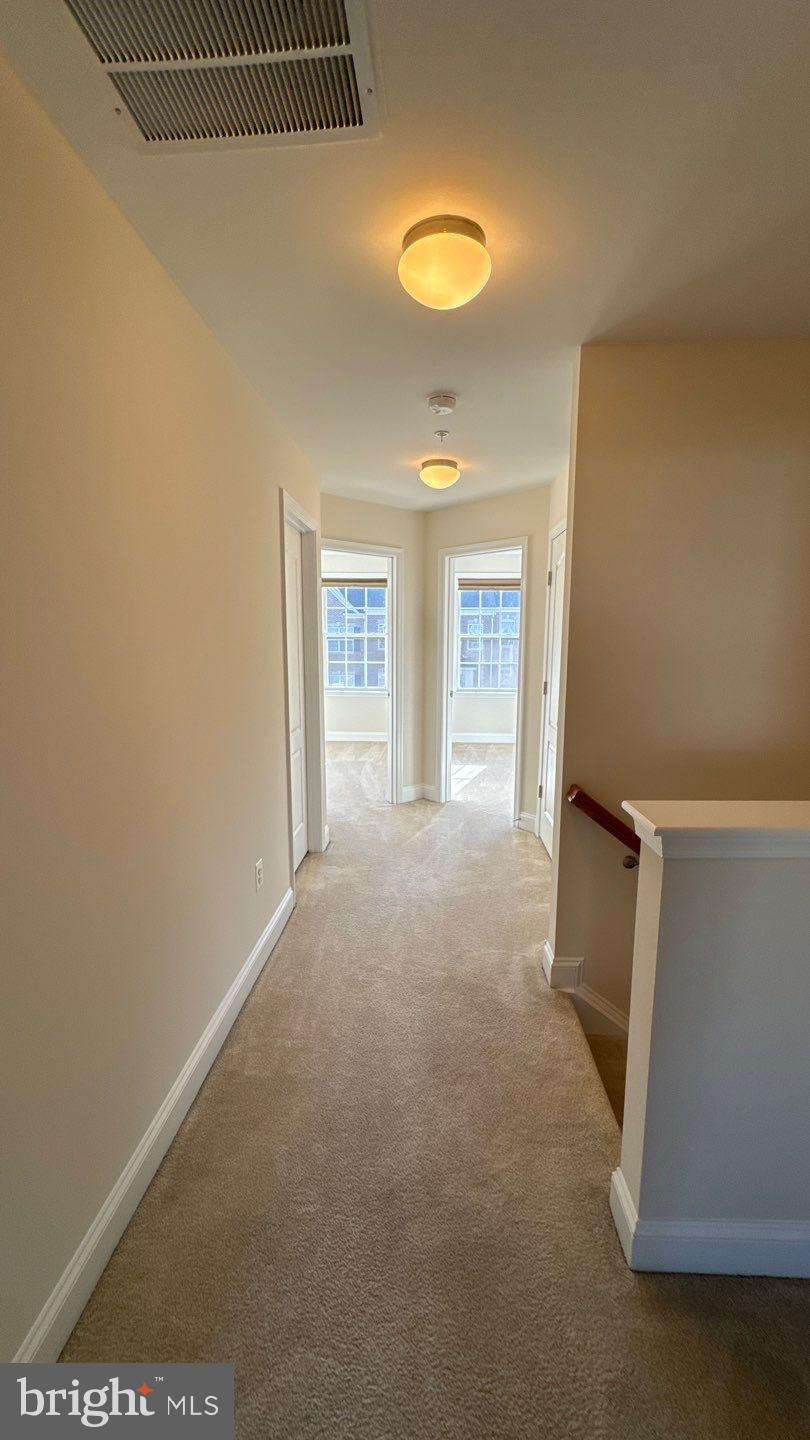 9727 June Flowers Way Laurel, MD 20723 - Photo 21 of 30 a view of an empty room with a window