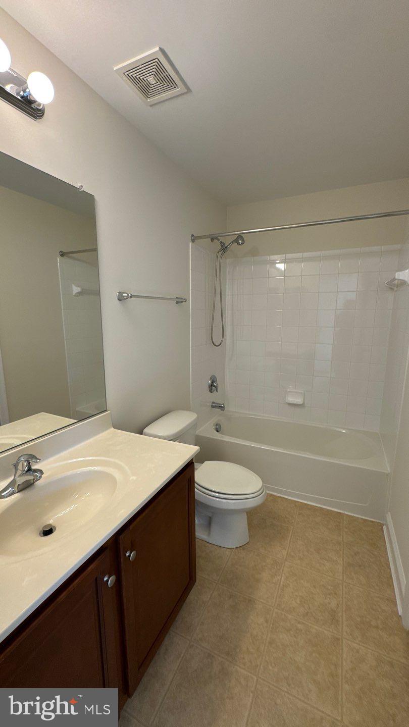 9727 June Flowers Way Laurel, MD 20723 - Photo 22 of 30 a bathroom with a sink a toilet and shower