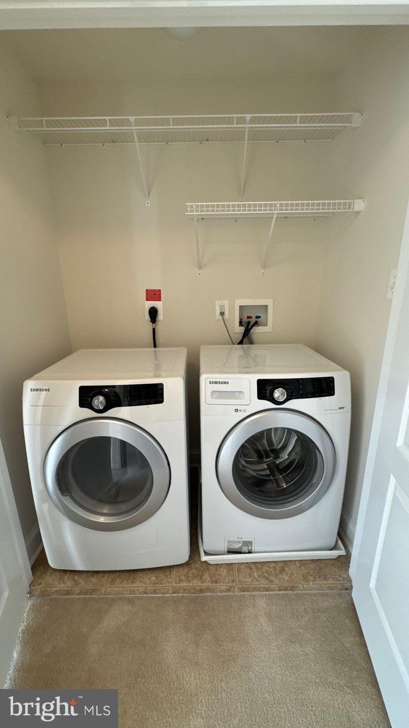 9727 June Flowers Way Laurel, MD 20723 - Photo 25 of 30 a bathroom with a toilet and a sink