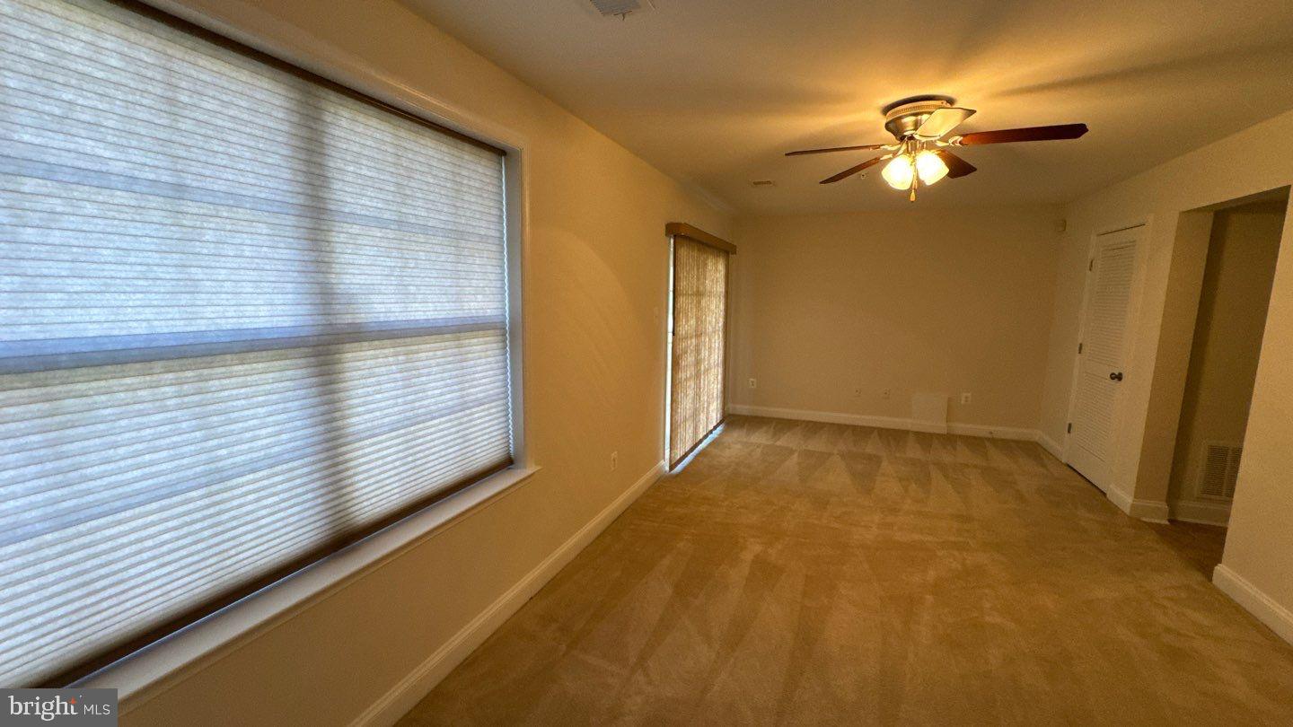 9727 June Flowers Way Laurel, MD 20723 - Photo 26 of 30 a view of an empty room with a window