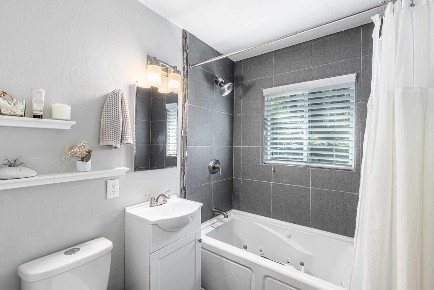 5914 Channel Drive Santa Rosa, CA 95409 - Photo 14 of 29 a bathroom with a bathtub shower sink vanity and toilet