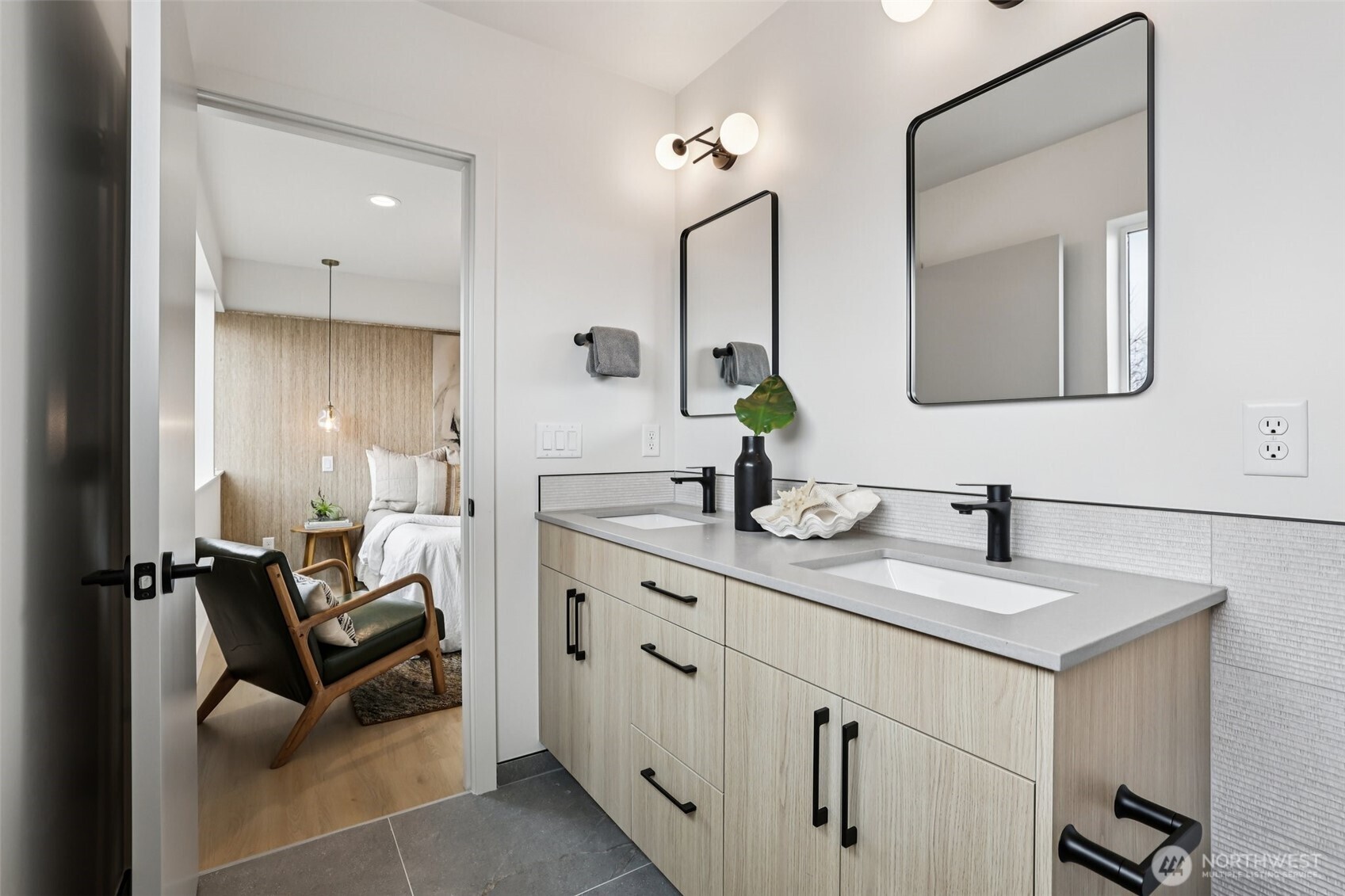 2626 A 58th Avenue Southwest Seattle, WA 98116 - Photo 17 of 40 a en suite bathroom with double sink and a mirror