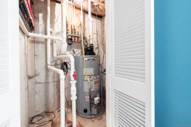 a spacious bathroom with a toilet a sink and mirror