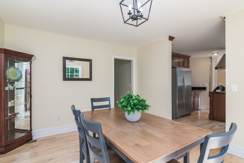 958 East Pleasant Street Amherst, MA 01002 - Photo 18 of 42 a view of a dining room with furniture and a chandelier