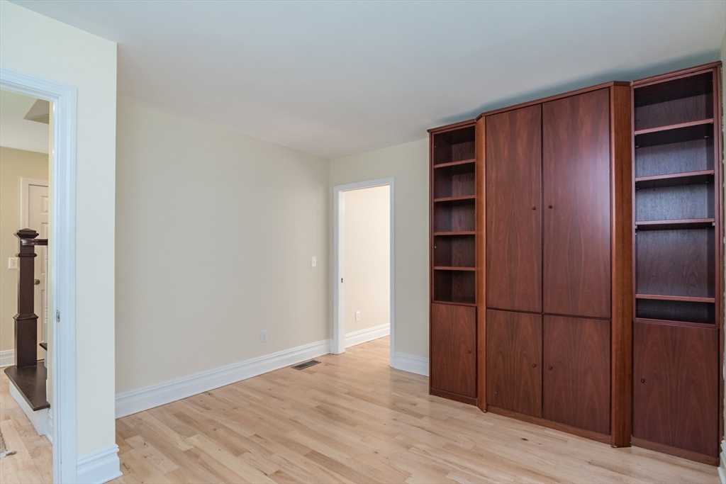 958 East Pleasant Street Amherst, MA 01002 - Photo 21 of 42 a view of an empty room with wooden floor and closet
