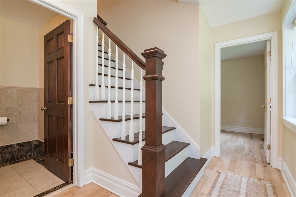 958 East Pleasant Street Amherst, MA 01002 - Photo 24 of 42 a view of entryway with wooden floor and stairs